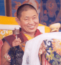 Garchen Rinpoche with ever-present mani wheel.